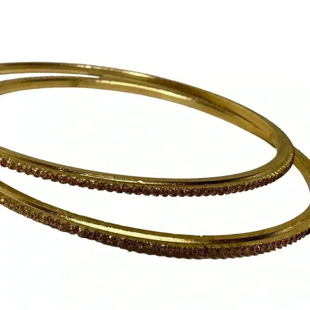 Multiple gold bangle bracelets random assortment of gold colored bracelets